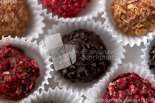 Image of close up of different candies in paper cups