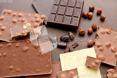 Image of chocolate bars with hazelnuts and cocoa beans