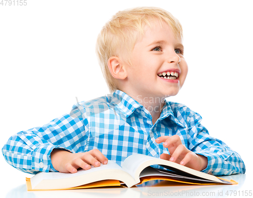 Image of Little child play with book