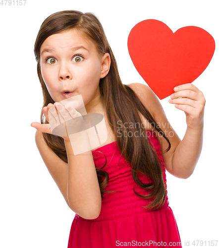 Image of Little girl is blowing a kiss