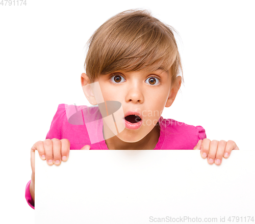 Image of Little girl is looking out from the blank banner