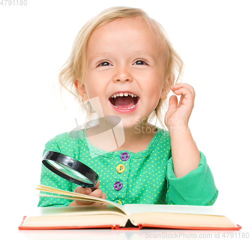 Image of Little girl is reading her book