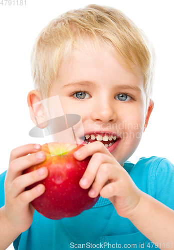 Image of Portrait of a cute little boy with red apple