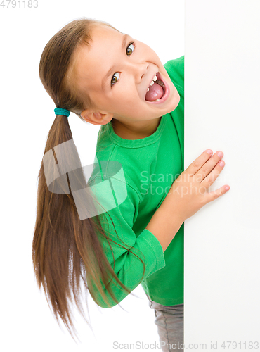 Image of Little girl is looking from out blank board