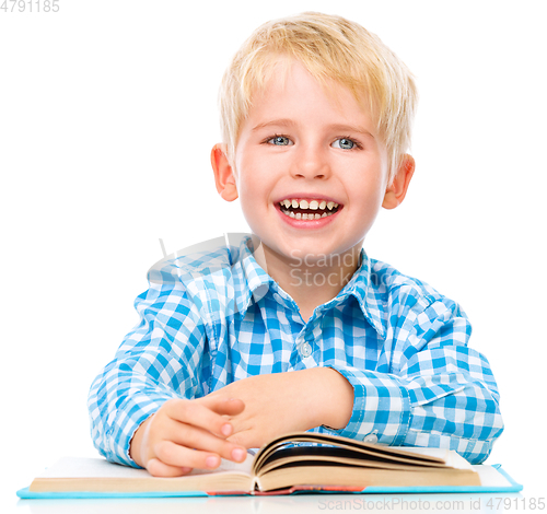 Image of Little child play with book