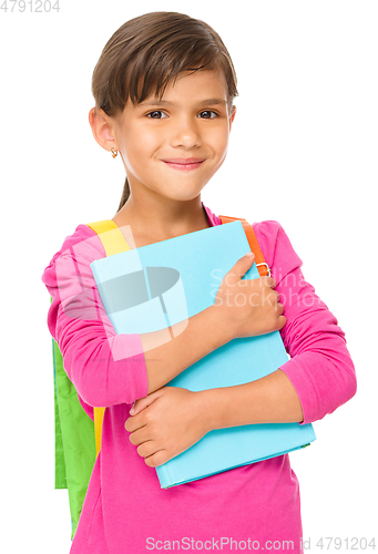 Image of Young girl is holding book