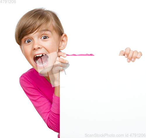 Image of Little girl is looking out from the blank banner