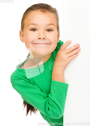 Image of Little girl is looking from out blank board