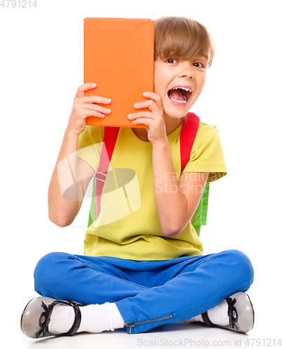 Image of Portrait of a cute little schoolgirl with backpack