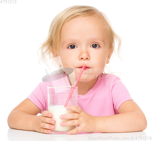 Image of Cute little girl with a glass of milk