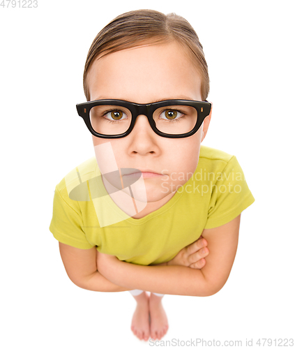 Image of Portrait of a sad little girl wearing glasses