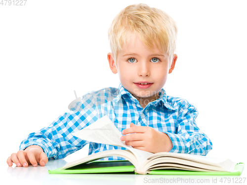 Image of Little child play with book