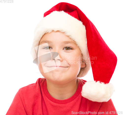 Image of Portrait of a cute little girl in santa hat