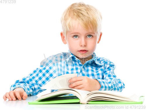 Image of Little child play with book