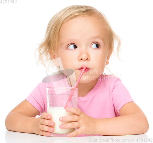 Image of Cute little girl with a glass of milk