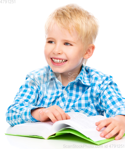 Image of Little child play with book