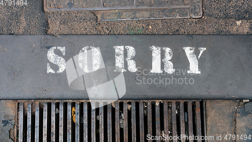 Image of word sorry at the street