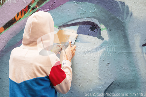 Image of street art artist at work