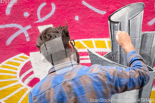 Image of street art artist at work