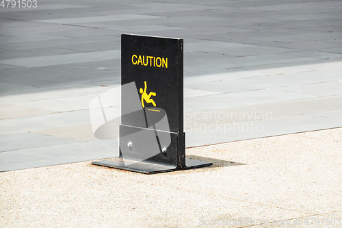 Image of typical caution sign on the floor