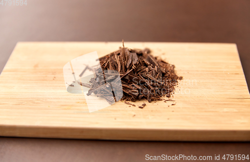 Image of chocolate chips on wooden board