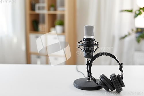 Image of headphones and microphone at home office