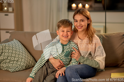 Image of happy smiling mother with her son at home