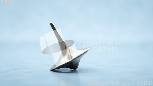 Image of Spinning top on a table