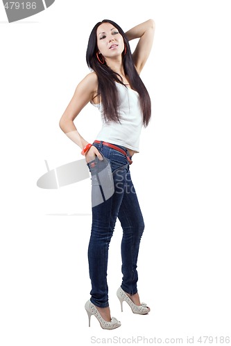 Image of The beautiful young woman in jeans. Isolated