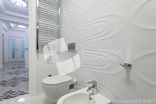 Image of Modern luxury white and chrome bathroom