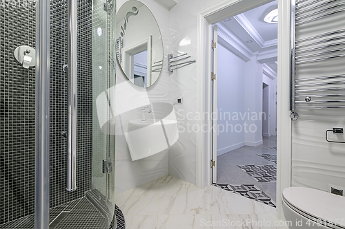 Image of Modern luxury white and chrome bathroom