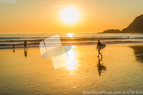 Image of Surfing at sunset, Algarve, Portugal
