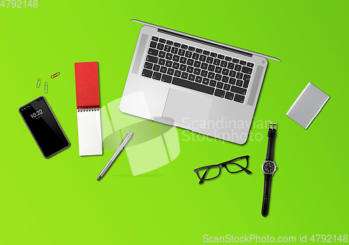Image of Office desk mockup top view isolated on green