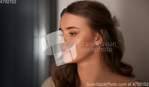 Image of portrait of young woman at home