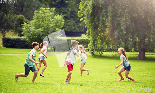 Image of happy kids running and playing game outdoors