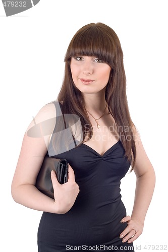 Image of Portrait of the young woman with a handbag in a black dress. Iso