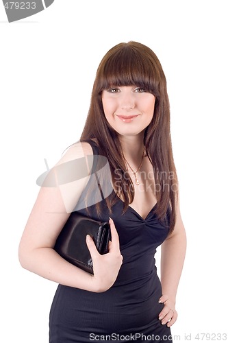 Image of Portrait of the smiling young woman with a handbag in a black dr