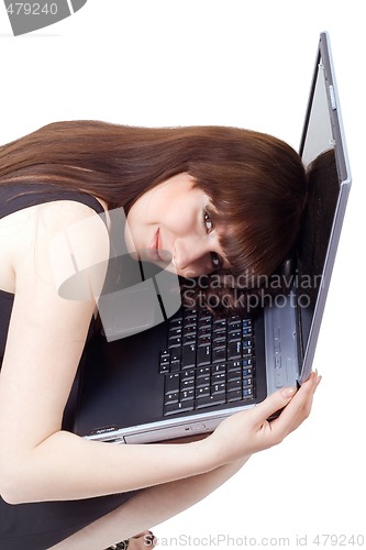 Image of The young businesswoman lies on the laptop. Isolated