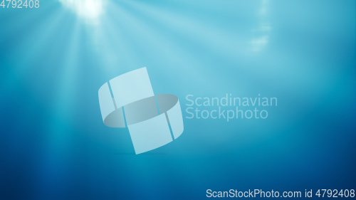 Image of deep water with light rays background
