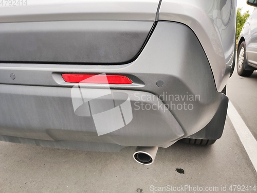 Image of Back of a car with an exhaust pipe