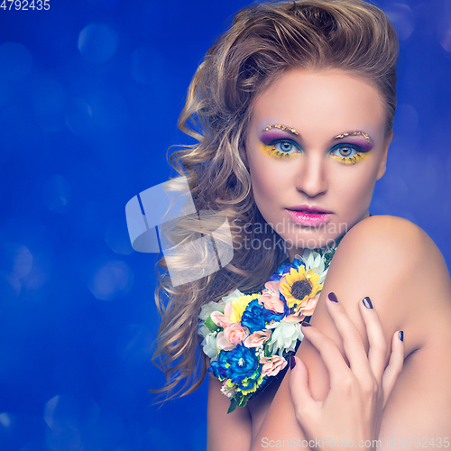 Image of beautiful girl with flower accessories