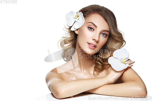 Image of beautiful blond girl with flower