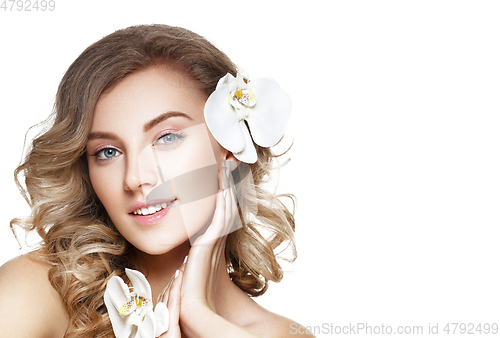 Image of beautiful blond girl with flower