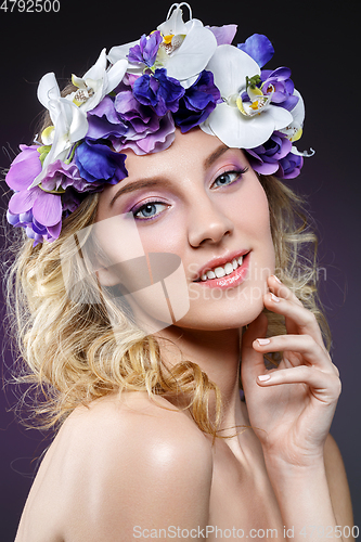 Image of beautiful blond girl with flowers