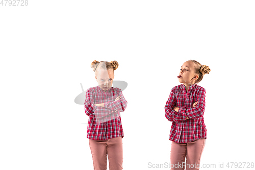 Image of Young handsome girl arguing with herself on white studio background.