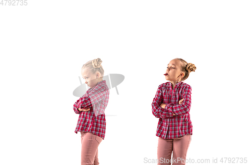 Image of Young handsome girl arguing with herself on white studio background.