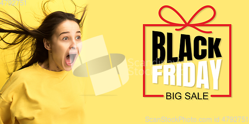 Image of Portrait of young caucasian woman surprised and shocked of black friday