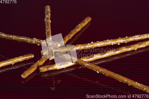 Image of salt sticks on dark ground