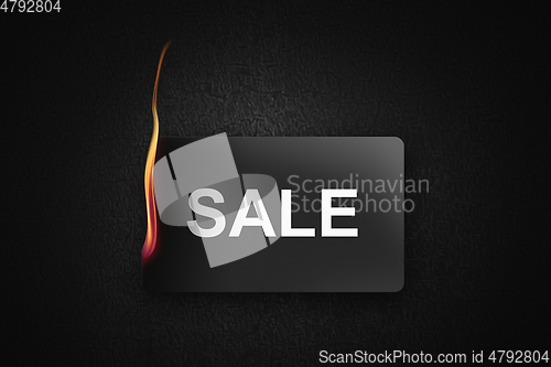 Image of fire sale credit card on black background