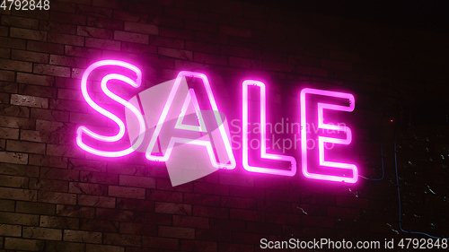 Image of neon light sale sign